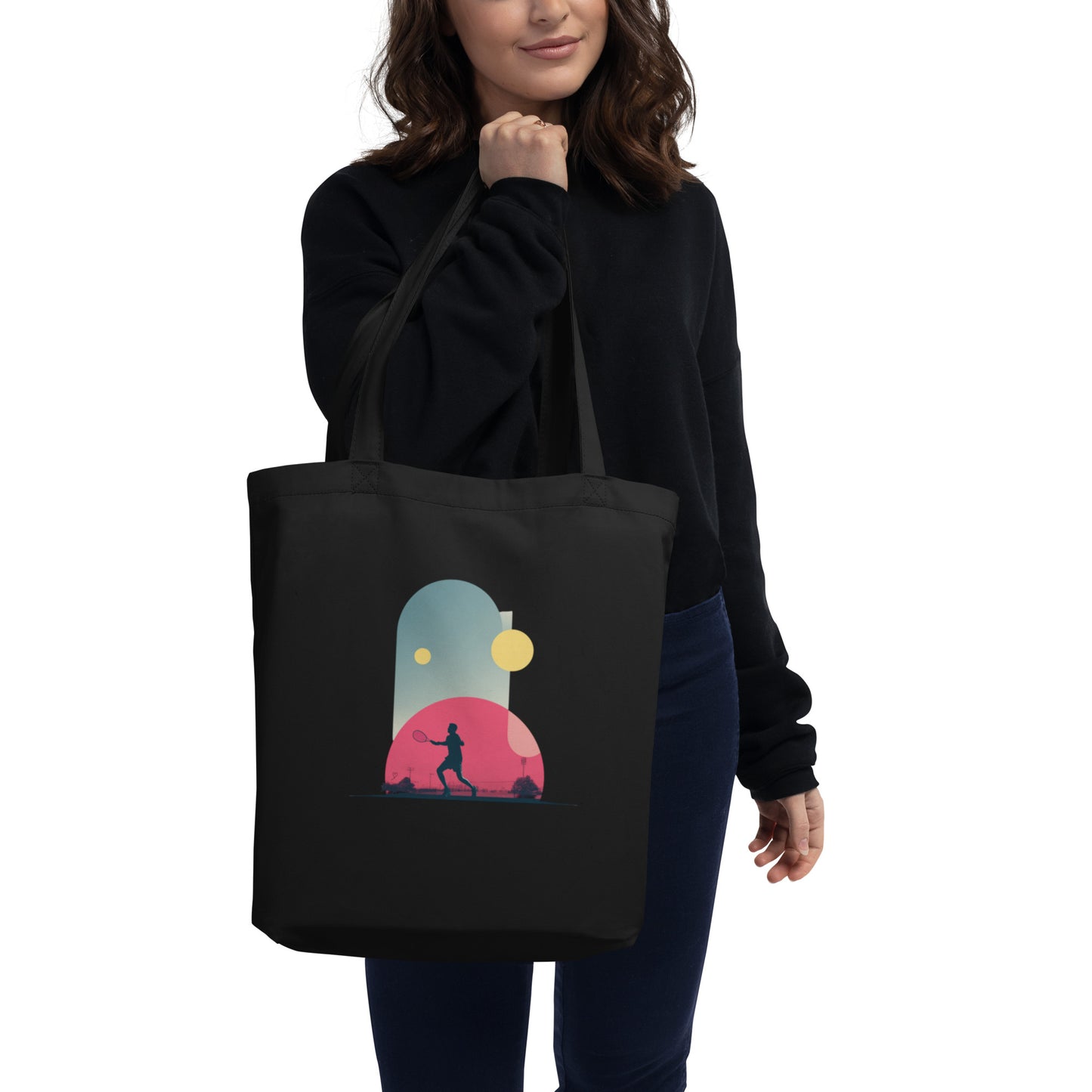 Tote-bag Smash Chromatique en coton bio noir avec illustration colorée d’un joueur de tennis en action, mélange de rose vif, bleu et jaune lumineux, style graphique dynamique, sur fond évoquant un court en plein air.