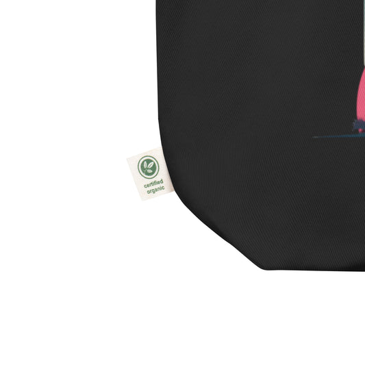 Tote-bag Smash Chromatique en coton bio noir avec illustration colorée d’un joueur de tennis en action, mélange de rose vif, bleu et jaune lumineux, style graphique dynamique, sur fond évoquant un court en plein air. Vue sur le détail de l'étiquette "certified organic" , zoom sur le coin inférieur du sac.